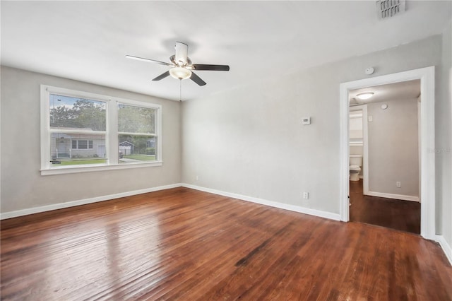 empty room featuring hardwood / wood-style floors and ceiling fan