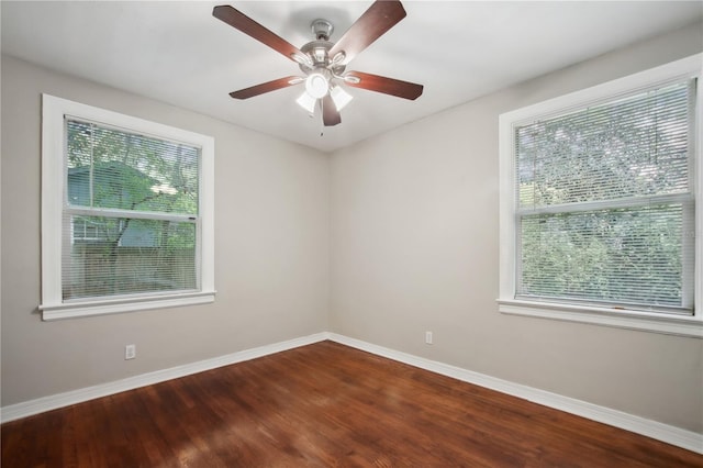 unfurnished room with ceiling fan, hardwood / wood-style floors, and a healthy amount of sunlight