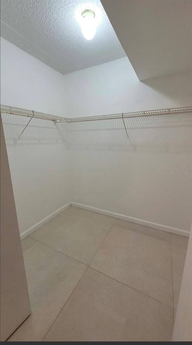 walk in closet featuring tile patterned floors