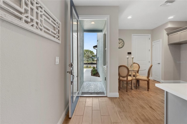 doorway to outside featuring light hardwood / wood-style floors