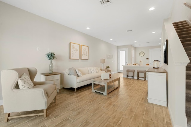 living room with light hardwood / wood-style floors