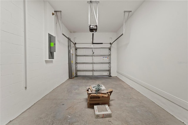 garage featuring electric panel and a garage door opener