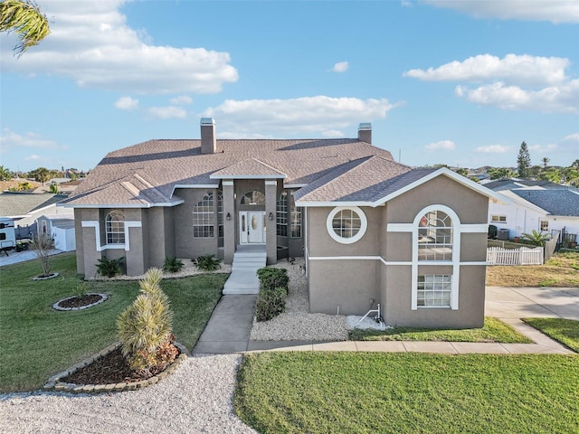 ranch-style home with a front yard