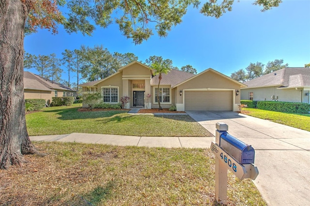 single story home featuring a front lawn and a garage