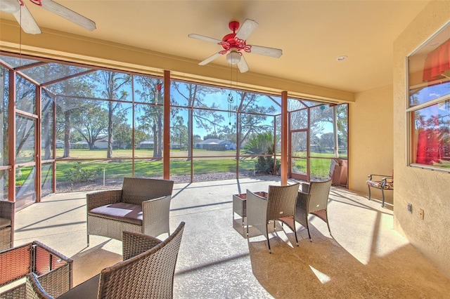 sunroom / solarium with ceiling fan