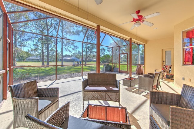 sunroom / solarium featuring ceiling fan