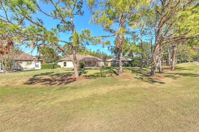 view of yard with a lanai