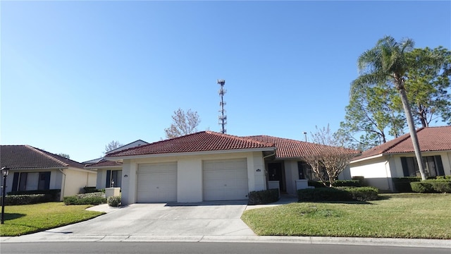 view of front of house featuring a front lawn and a garage