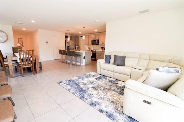 living room with light tile patterned floors