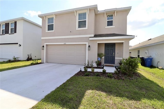 view of front facade featuring a front yard and a garage