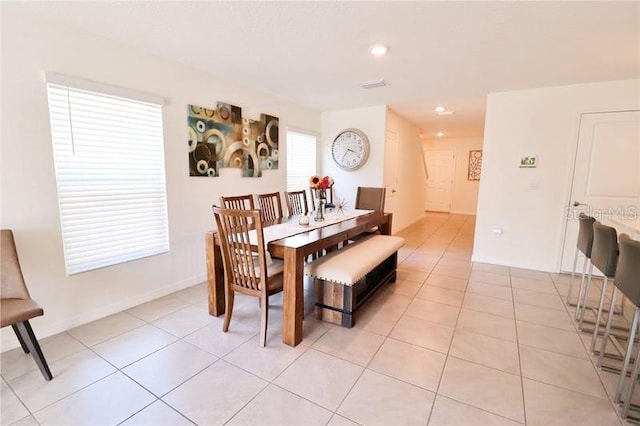 dining area featuring light tile patterned floors