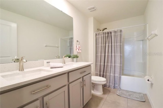 full bathroom featuring shower / bathtub combination with curtain, tile patterned flooring, vanity, and toilet