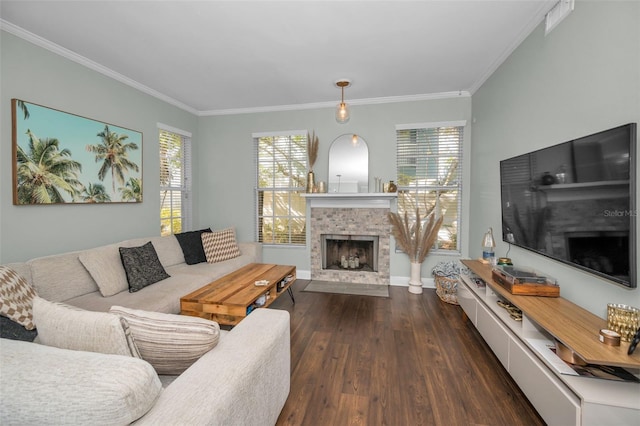 living room with a healthy amount of sunlight, dark hardwood / wood-style floors, and ornamental molding