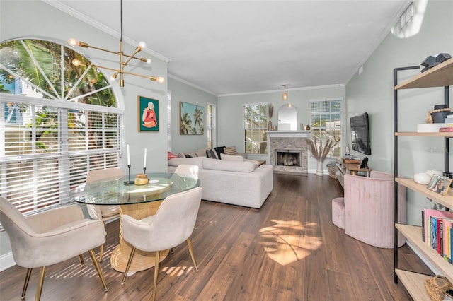 dining area with a chandelier, dark hardwood / wood-style flooring, and ornamental molding