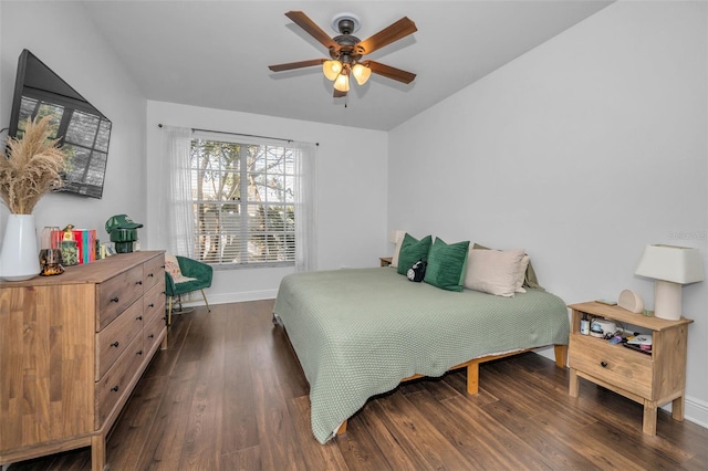 bedroom featuring ceiling fan and dark hardwood / wood-style floors