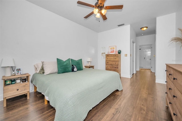 bedroom featuring dark hardwood / wood-style flooring and ceiling fan