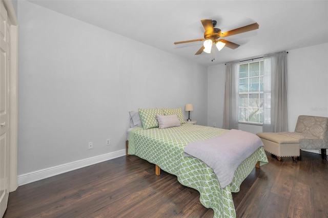 bedroom featuring ceiling fan and dark hardwood / wood-style flooring