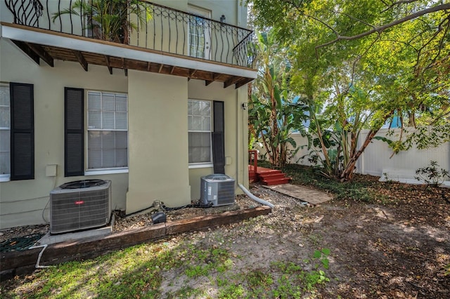 exterior space with central AC and a balcony