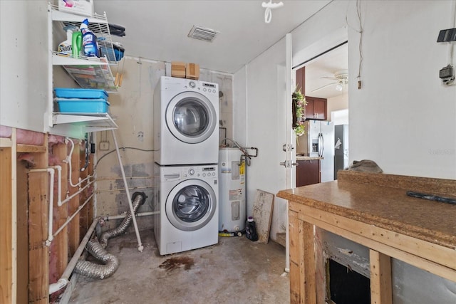 laundry room featuring electric water heater, stacked washing maching and dryer, and ceiling fan