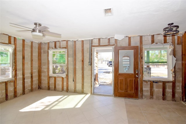 miscellaneous room featuring a wealth of natural light and ceiling fan