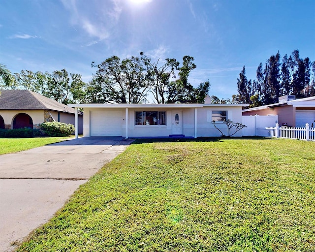 single story home featuring a front yard and a garage