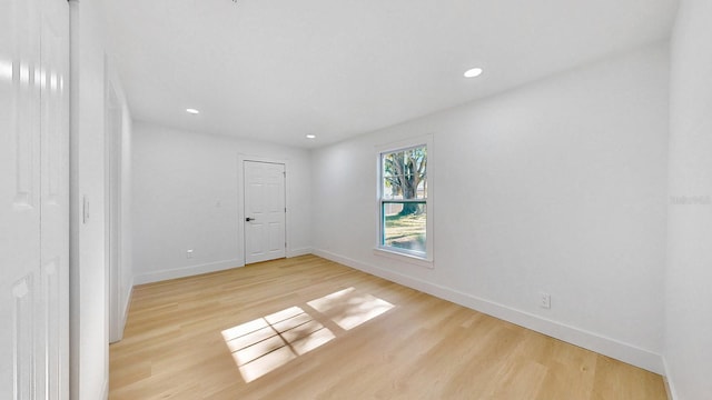 empty room with light hardwood / wood-style floors