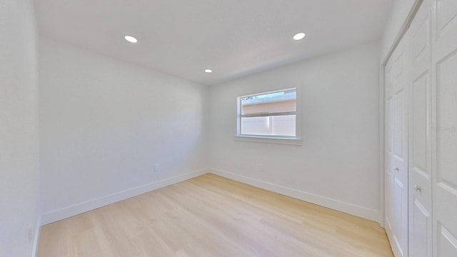 empty room with light wood-type flooring