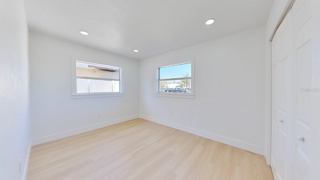 unfurnished room with light hardwood / wood-style flooring