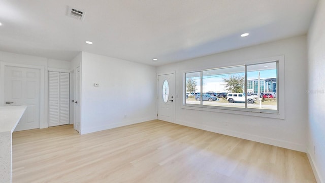 unfurnished room with light hardwood / wood-style floors