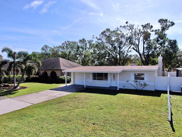 ranch-style house with a front yard and a garage