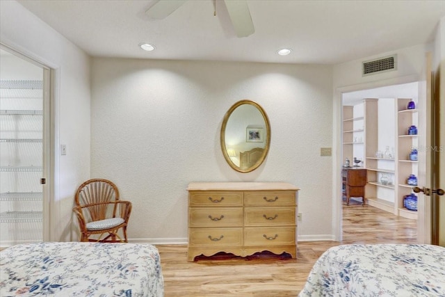 bedroom with ceiling fan and light hardwood / wood-style floors