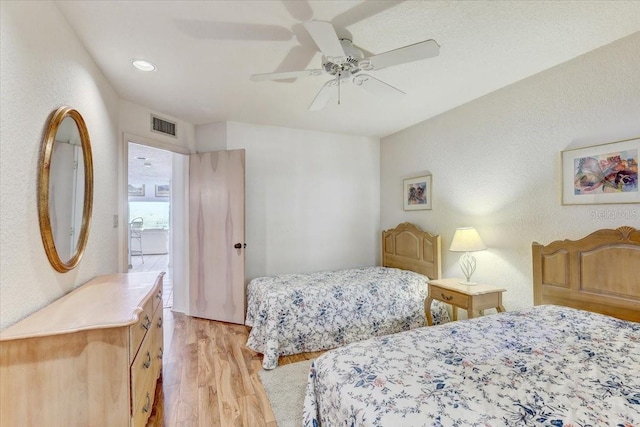 bedroom featuring light wood-type flooring and ceiling fan