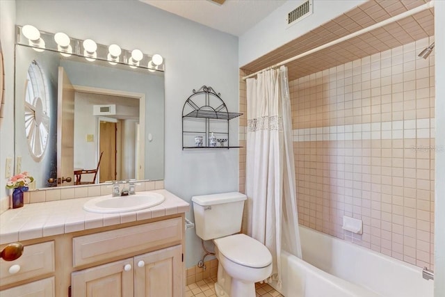 full bathroom with tile patterned flooring, vanity, toilet, and shower / bath combo