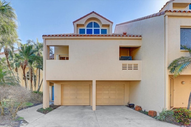 mediterranean / spanish-style house featuring a garage