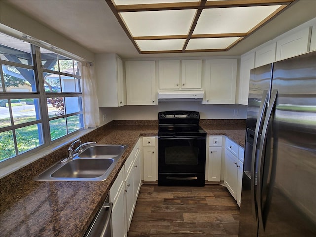 kitchen featuring white cabinets, appliances with stainless steel finishes, plenty of natural light, and sink