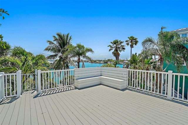 wooden deck with a water view