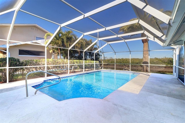 view of swimming pool with a lanai and a patio