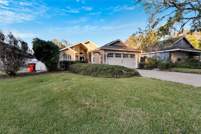 view of front of home featuring a front yard and a garage