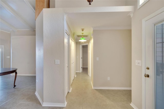 corridor featuring ornamental molding and light tile patterned flooring