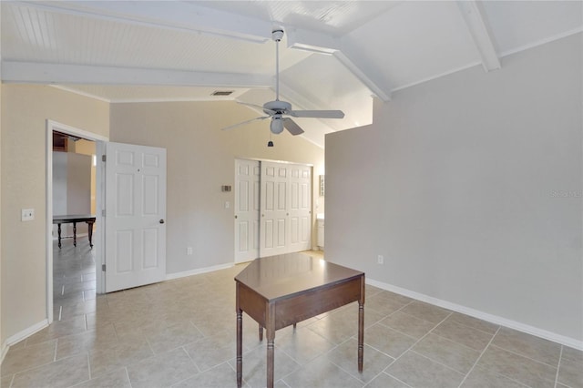 unfurnished office featuring vaulted ceiling with beams, ceiling fan, and light tile patterned flooring