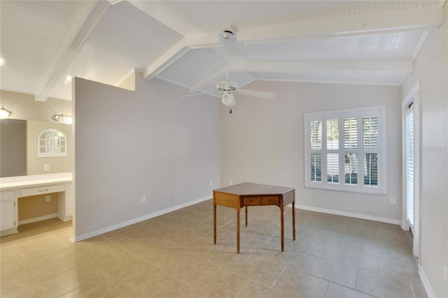 interior space featuring lofted ceiling with beams, ceiling fan, and built in desk