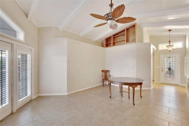 interior space with beam ceiling, a wealth of natural light, and ceiling fan