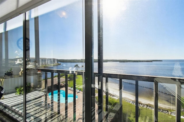 balcony featuring a water view