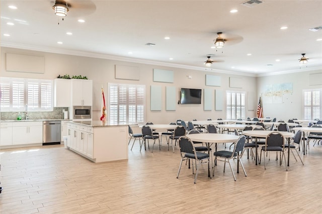 dining room with plenty of natural light and light hardwood / wood-style floors