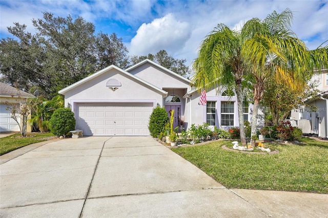 view of front of home featuring a garage and a front lawn