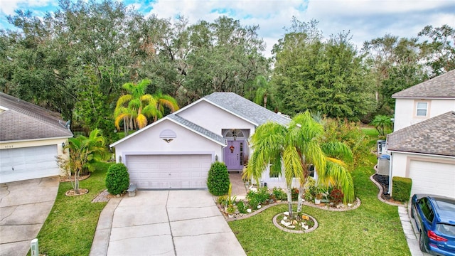 single story home with a garage and a front yard