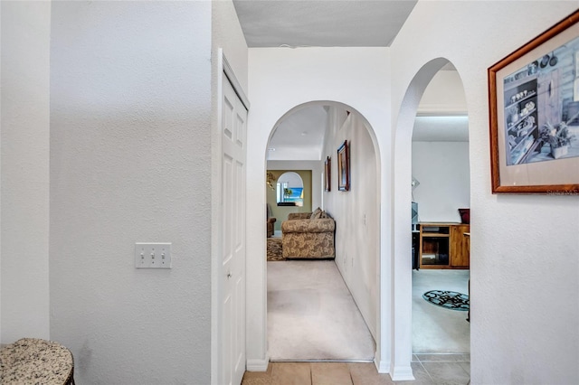 hallway with light tile patterned floors