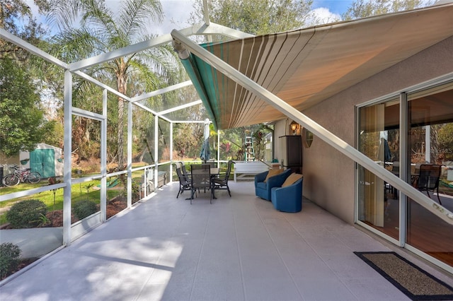 view of patio / terrace with glass enclosure