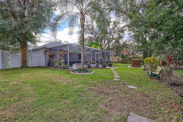 view of yard with glass enclosure