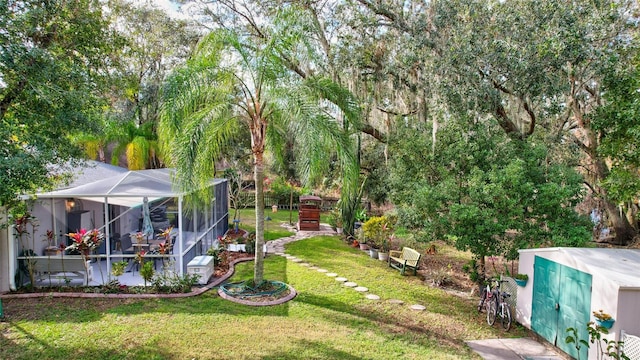 view of yard featuring a lanai